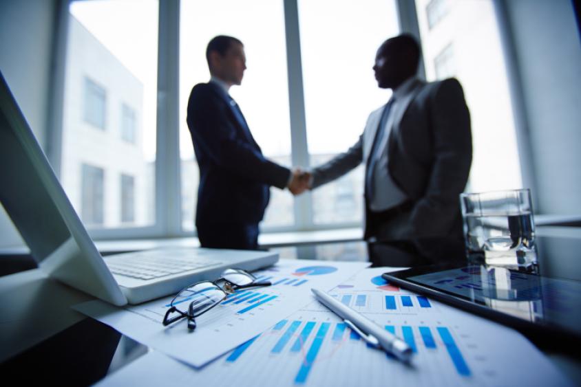 Two men shaking hands on a deal