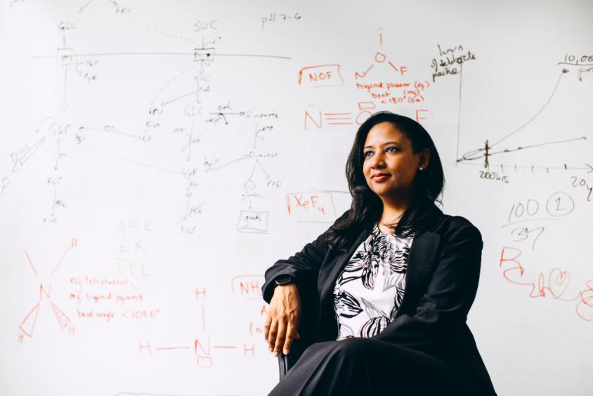 Kristala Prather in front of a whiteboard